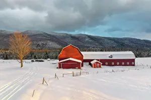 Snow Flurry Prints: Winter sunrise over red barn and dairy farm in Green Mountains