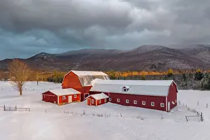 Snow Flurry Prints: Winter sunrise over red barn and dairy farm in Green Mountains
