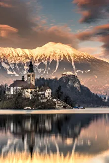 South East Europe Prints: Winter sunset over Church of the Assumption of Mary, Lake Bled, Upper Carniola, Slovenia