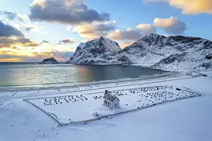 Grave Prints: Winter view of the church and the cemetery covered with snow after snowfall at susnet