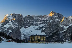 Winter view of frozen Lake Misurina with Sorapiss mountain group in the foreground Winter view of frozen Lake Misurina with Sorapiss mountain group in the foreground