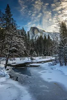 Loneliness Prints: Winter view over icy Tenaya creek with Half Dome mountain behind, Yosemite National Park