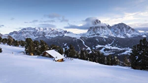 a winter view of the Val Gardena with Sella Group and Langkofel Group in the background