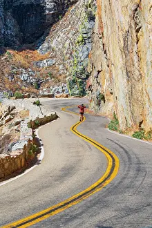 Outodoor Prints: a woman admire the famous Kings Canyon mountain road on a summer day
