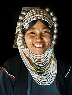 Myanmar Gallery: A woman from Akha tribal village wearing traditional headdress made of heavy silver