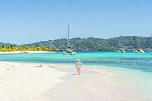 White Sand Prints: A woman on a beach on Sandy Island, Carriacou, Greneda, caribbean. MR