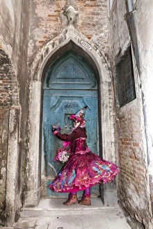 Images Dated 2nd May 2017: Woman in costume at blue door during Venice Carnival, Venice, Veneto, Italy