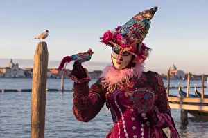 Post Prints: Woman in costume holding a bird at Carnival time and gull on post, Lagoon, Venice