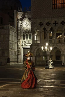 Images Dated 17th March 2020: A woman in costume poses in St. Marks square during the Venice Carnival, Venice