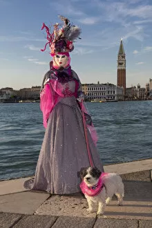 Images Dated 17th March 2020: A woman and her dog pose in costume during the Venice Carnival, San Giorgio Maggiore