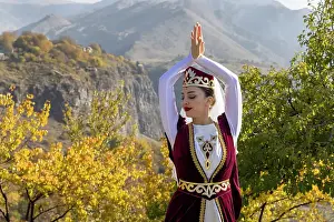 One Person Prints: A woman dressed in traditional costume dances at Garni temple, Armenia