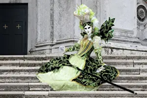 Salute Prints: Woman in green costume at Carnival time sitting on steps at Salute, Venice, Veneto, Italy
