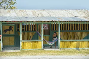 Woman and hammock near Yaxha Arecheologial site, Peten, Mundo Maya, Guatemala, Central Woman and hammock near Yaxha Arecheologial site, Peten, Mundo Maya, Guatemala, Central