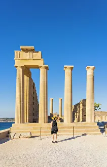 A woman in a hat at the Lindos Acropolis, Lindos, Rhodes, Dodecanese Islands, Greece. (MR)