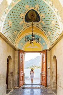 Symi Prints: A woman in a hat at Panormitis Monastery