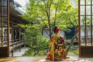 Costume Gallery: Woman looking out onto Zen garden, Kyoto, Japan