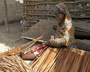 A woman makes makuti