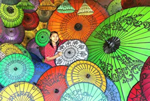 Painting Prints: Woman painting colourful parasols, Bagan, Myanmar (Burma), Asia