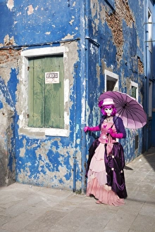 Old Building Prints: Woman in pink costume holding umbrella during Carnival, Island of Burano, Venice
