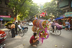 Images Dated 10th October 2012: Woman selling decorations for the Mid Autumn moon festival, Old Quarter, Hanoi, Vietnam