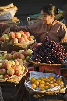 Rakhine State Prints: A woman sells a delicious selection of fresh fruit at Sittwes bustling market