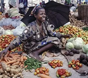 African Woman Gallery: A woman sells vegetables at Bati market