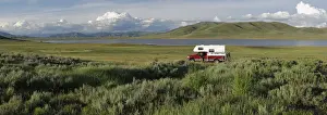 Idaho Prints: Woman standing next to her pick up camper, Little Camas Prarie Reservoir, Boise National