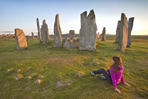 Sitting Prints: Woman staring at Neolithic stone circle, Callanish, Isle of Lewis, western scotland