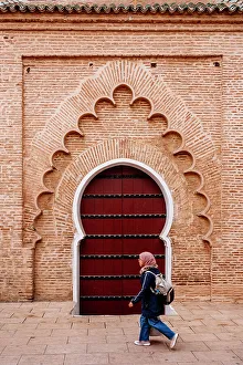 Arabesque Prints: Woman student and typical arab door, Marrakech, Morocco
