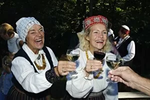 Images Dated 15th September 2006: Woman in Traditional Dress enjoying Food and Wine at