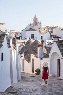 Images Dated 28th October 2016: Woman visiting the Trulli area, Alberobello, Itria valley, Apulia, Italy (MR)