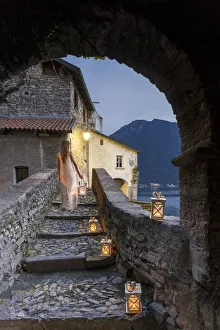 Nesso Prints: Woman walking along the bridge of the Civera with a lantern in the hand, Horrid of Nesso