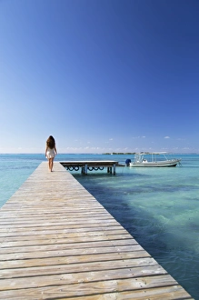 1 Person Prints: Woman walking on jetty, Hauru Point, Mo orea, Society Islands, French Polynesia (MR)