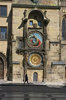 Images Dated 18th June 2020: Woman walking by Prague Astronomical Clock at Old Town Square, Prague, Bohemia