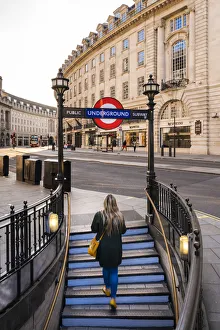 Afternoon Prints: Woman walking out the tube on to Regents Street, london, England, UK