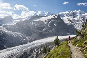 Girls Prints: Woman walks along the track above the Morteratsch glacier, Morteratsch, Engadine