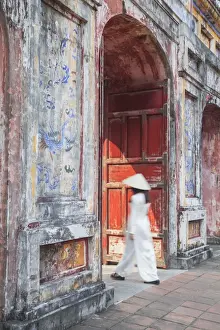 Wearing Prints: Woman wearing Ao Dai dress at Dien Tho inside Citadel, Hue, Thua Thien-Hue, Vietnam (MR)