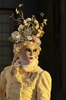 Images Dated 17th March 2020: A woman wearing a mask and a costume decorated with butterflies