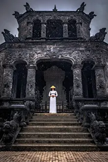 Steps Prints: Woman in white ao dai on steps of Khai Dinh Mausoleum, Hue, Central Vietnam. (MR)