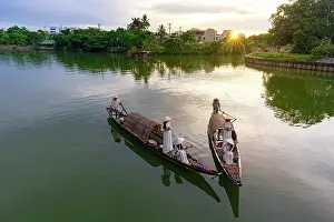 Women Prints: Women on boats with traditional paper lanterns, Nhu Y River, Hue, Central Vietnam. (MR)
