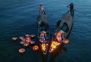 Lantern Prints: Women laying floating lanterns on the Perfume River at dusk, Hue, Central Vietnam