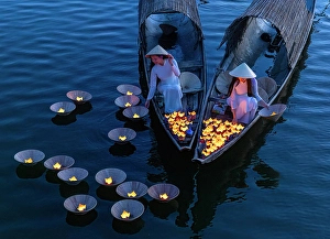 Lantern Prints: Women laying floating lanterns on the Perfume River at dusk, Hue, Central Vietnam