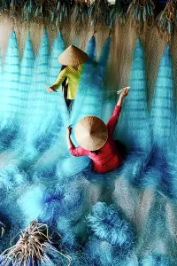 Women Prints: Women mending fishing nets, Vietnam. (MR)