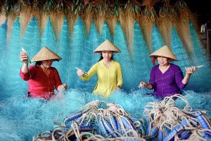 Nets Prints: Women mending fishing nets, Vietnam. (MR)