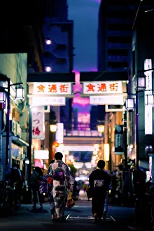 Clothing Prints: women in traditional clothes stroll at sunset in Asakusa, Tokyo, Japan