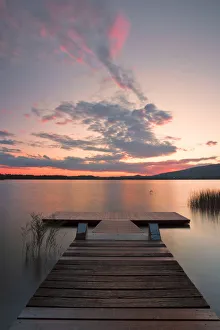 Wood pier on Pusiano lake at sunset, Bosisio Parini, Lecco province, Lombardy, italy