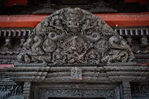Black Prints: Wooden carvings above door at Pashupatinath temple on the Bagmati river, Kathmandu, Nepal