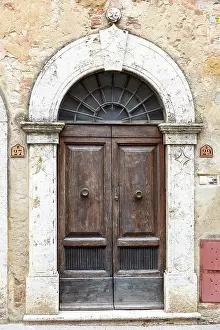 Q2 2025 Prints: Wooden door and stone arch in the ancient village of Montisi