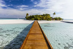 Images Dated 16th December 2017: Wooden jetty to a tropical island, Maldives