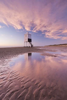 Wooden lighthouse and reflections on Burnham Beach at low tide, Burnham on Sea, Somerset